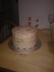 crumb coat of skittles buttercream